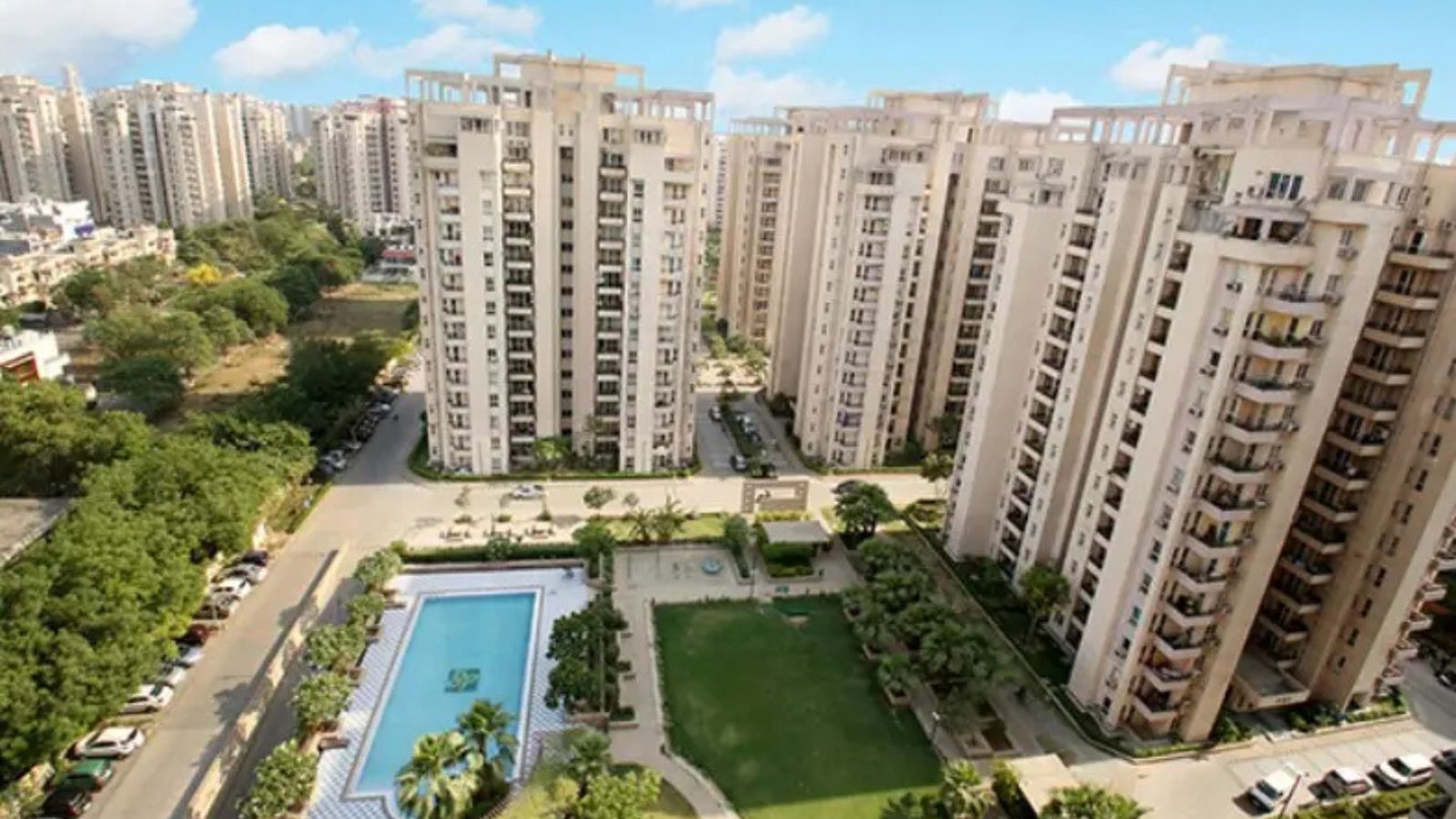 Orchid Petals high-rise towers around the central pool and gardens, aerial view