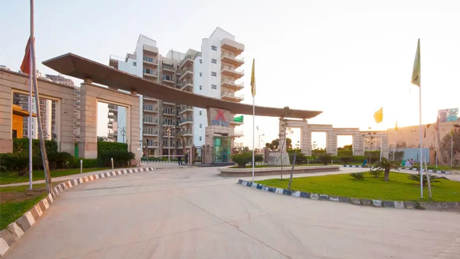 Spaze Privy entrance gateway with canopy and residential tower