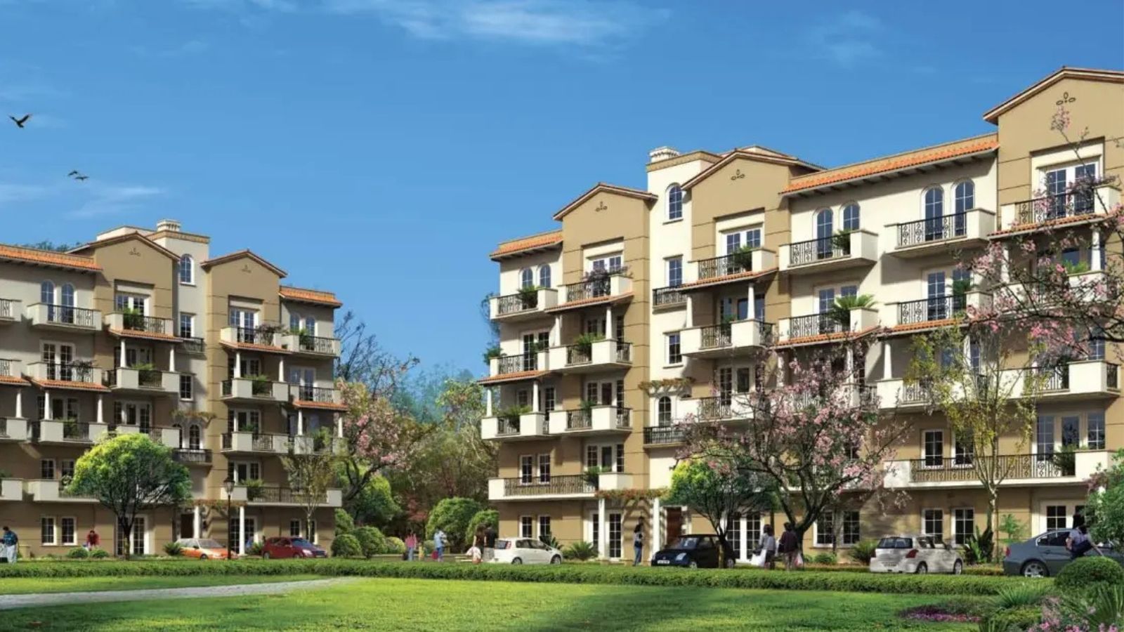 Emaar MGF Emerald Floors Premier low-rise apartment blocks across a landscaped lawn, artist's impression