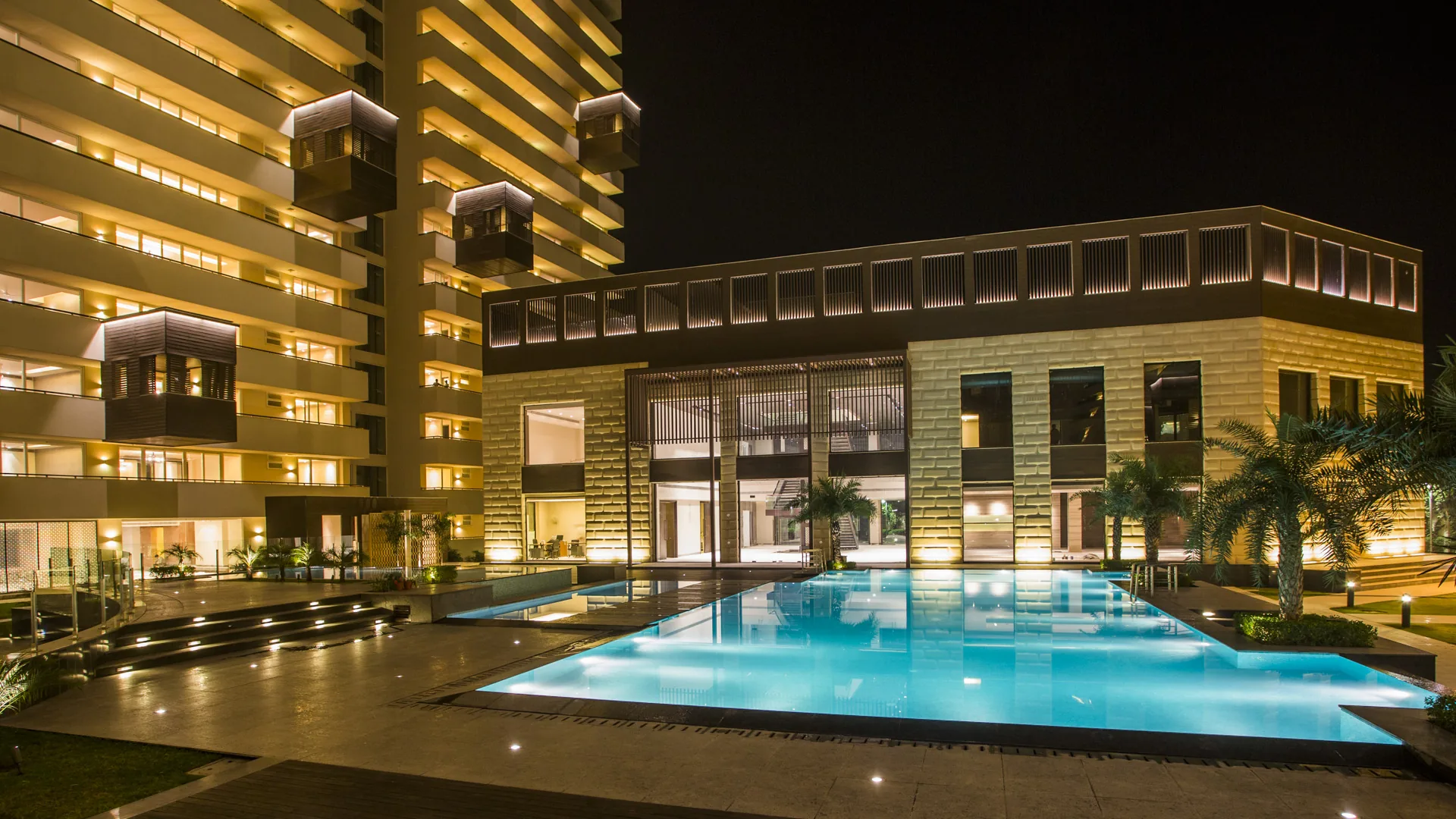Salcon The Verandas pool and towers at night, Golf Course Road Sector 54
