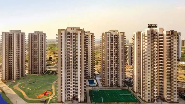 Adani M2K Oyster Grande towers and tennis courts at sunset, Sector 102/102A, artist's impression
