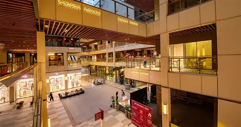 AIPL Joy Central atrium and shop fronts across three levels