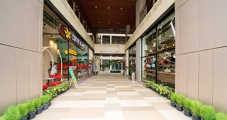 AIPL Joy Central cafe corridor on the retail floor