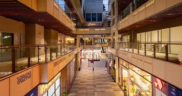 AIPL Joy Central central atrium with retail floors around it