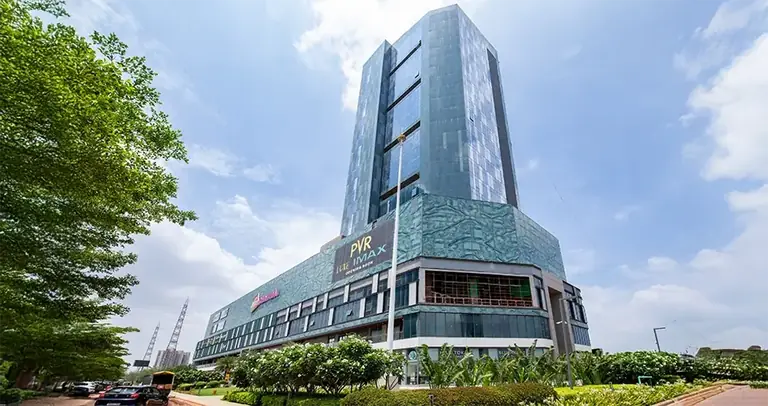 AIPL Joy Central tower seen from the road with its glass facade