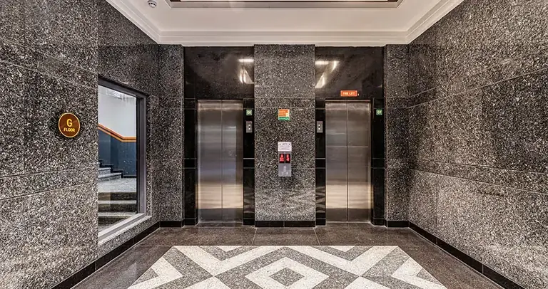 AIPL Joy Street lift lobby with granite flooring