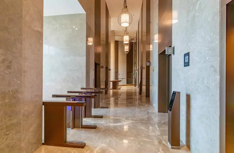 AIPL Signature access gates and lift corridor in marble