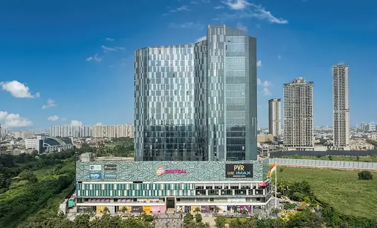 AIPL Signature tower with the Joy Central podium and the Sector 65 skyline