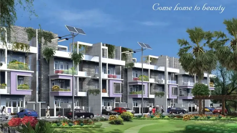 Ansal API Esencia builder floors with balconies facing a lawn and solar street lights, artist's impression
