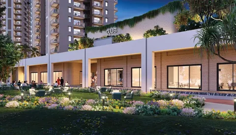 Ashiana Aaroham clubhouse front with a planted lawn and seating, artist's impression
