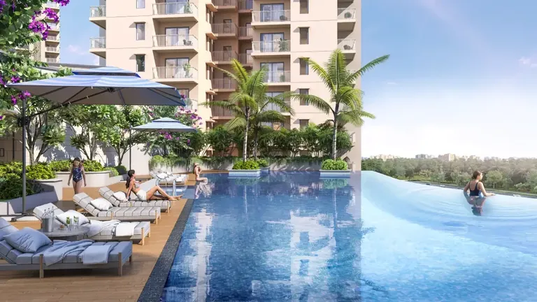 Ashiana Aaroham clubhouse infinity pool with loungers and umbrellas, artist's impression
