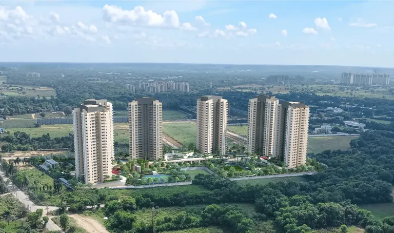 Ashiana Aaroham towers rising over open fields in Sector 80, artist's impression