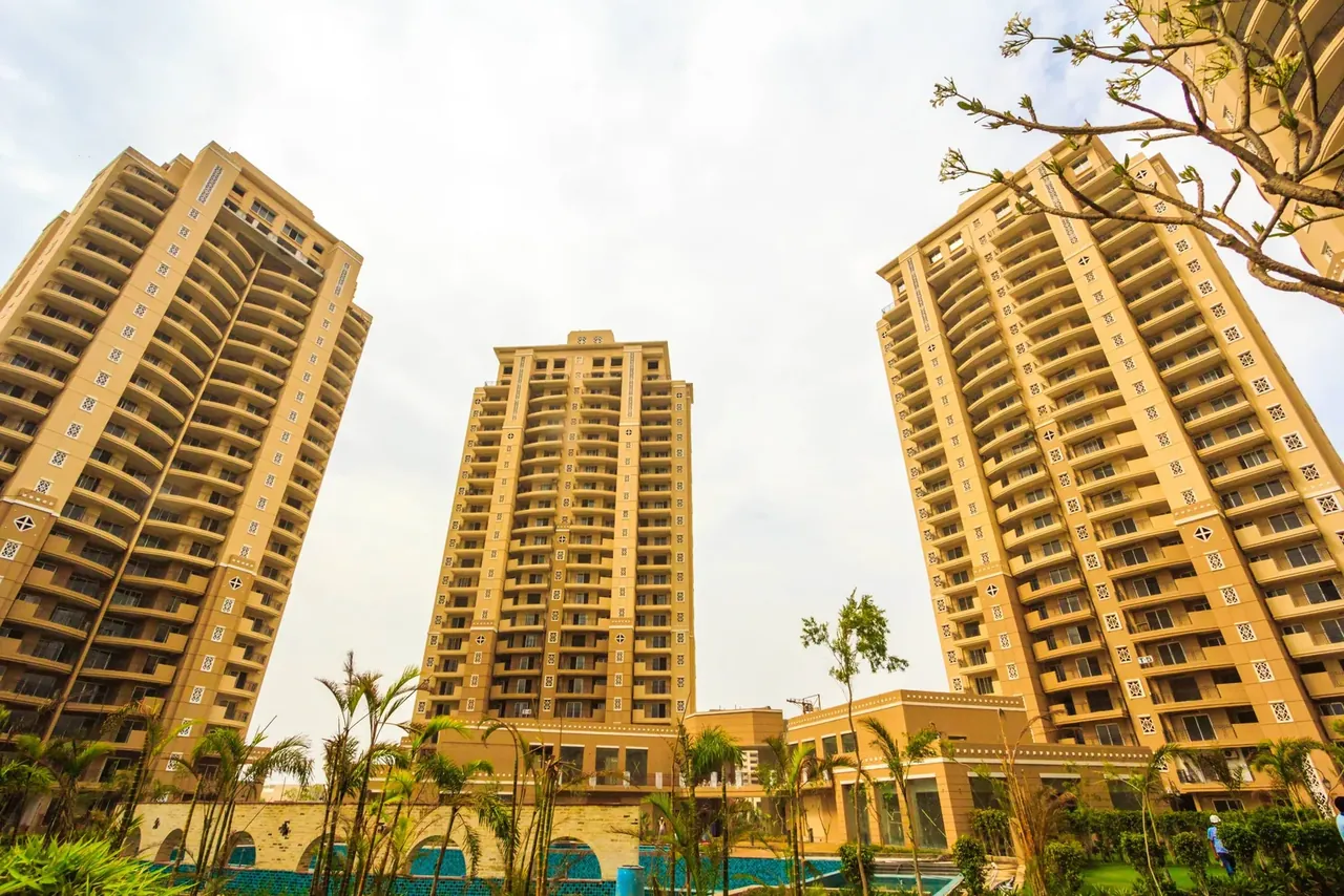ATS Kocoon three towers seen from the podium garden, low-angle photo