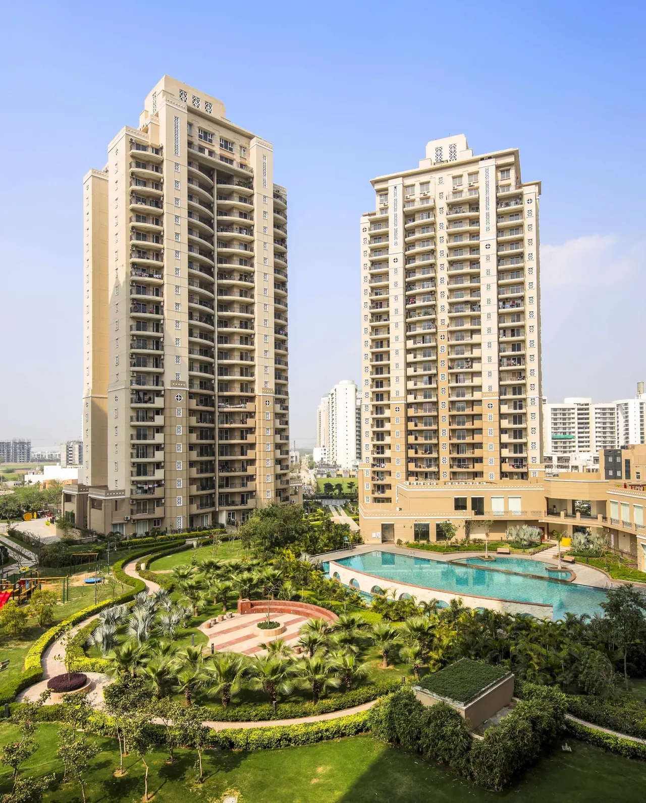 ATS Kocoon two towers above the pool and flower gardens, photo