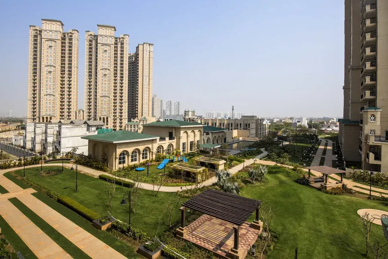 ATS Triumph towers above the podium lawns and pergola, photo