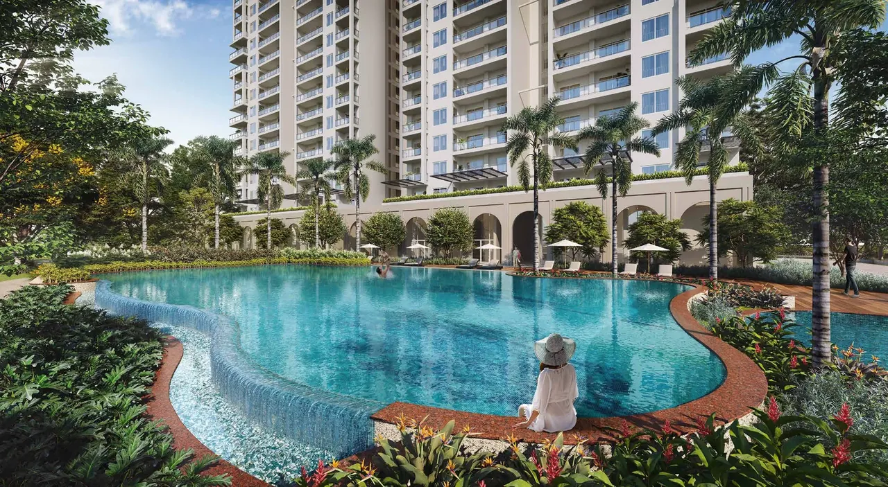Birla Pravaah swimming pool with pool deck and landscaped edges beside the towers, artist's impression