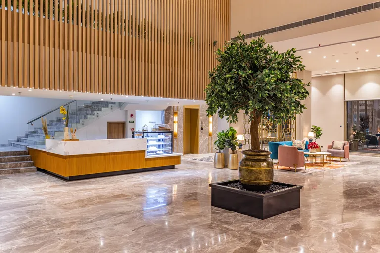 BPTP Amstoria clubhouse reception desk and marble lobby, photo