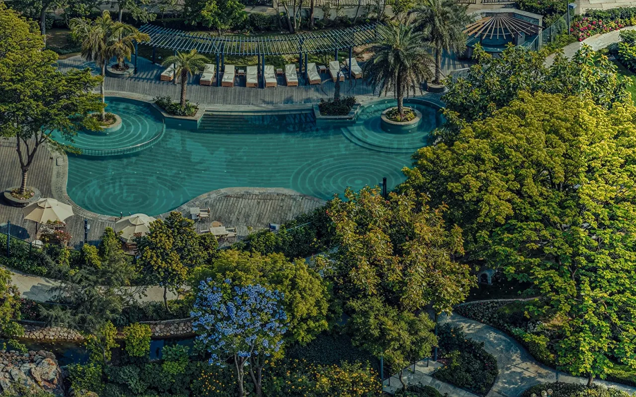 BPTP Astaire Gardens aerial view of the lagoon-style pool within the 3-acre Garden of Dreams
