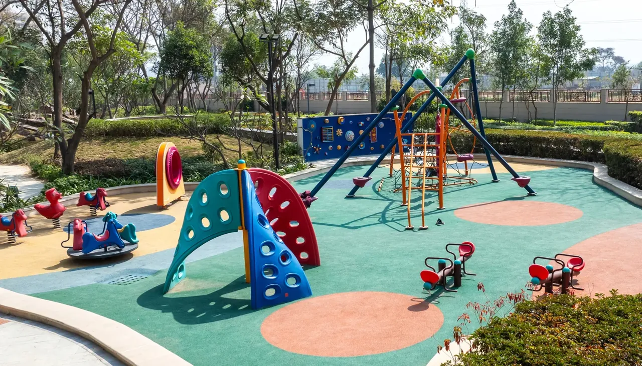 BPTP Astaire Gardens children's play area with climbing frames and soft flooring
