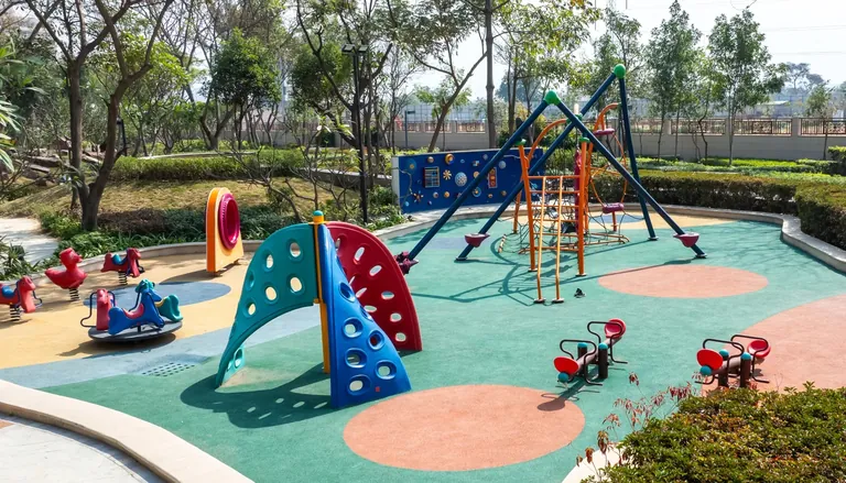 BPTP Astaire Gardens children's play area with climbing frames and soft flooring