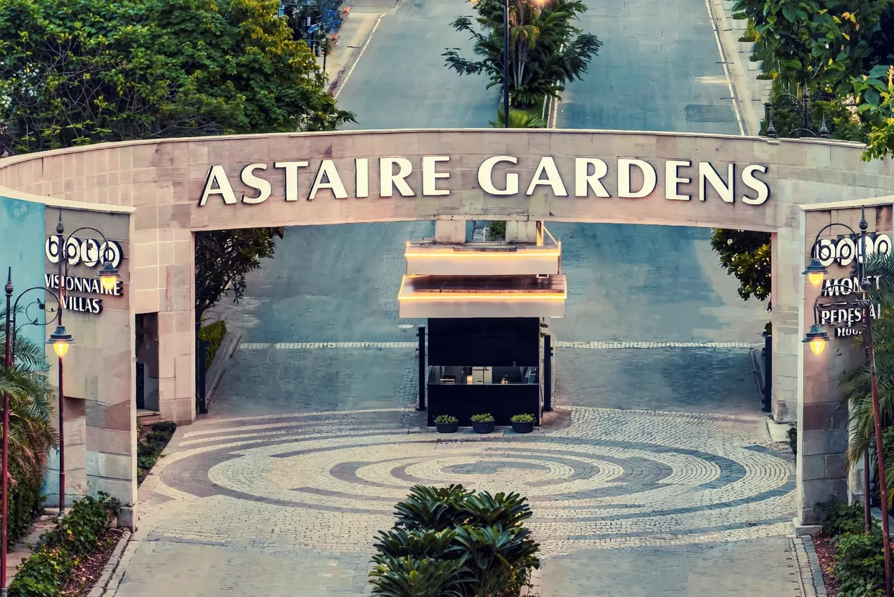 BPTP Astaire Gardens main entrance gate and tree-lined entry avenue, Sector 70A