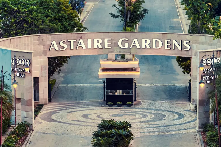 BPTP Astaire Gardens main entrance gate and tree-lined entry avenue, Sector 70A