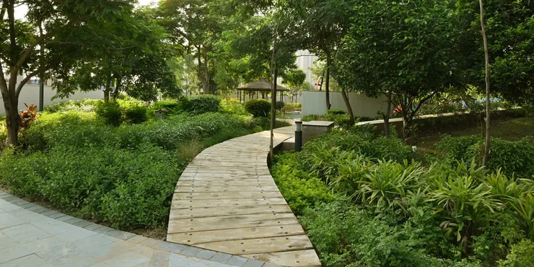 BPTP Astaire Gardens stone walkway through the garden park