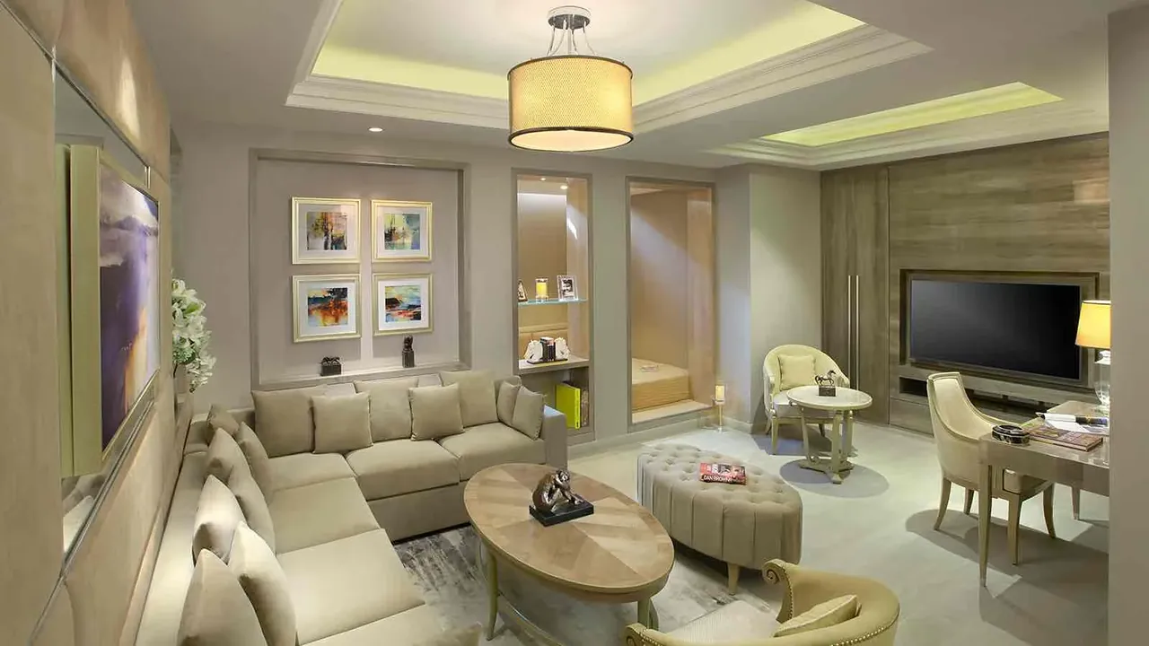 Central Park Cerise Floors living room with sofas and a TV wall