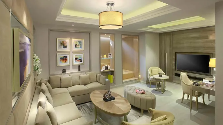 Central Park Cerise Floors living room with sofas and a TV wall