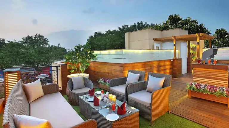 Central Park Cerise Floors roof terrace with a hot tub and lounge seating