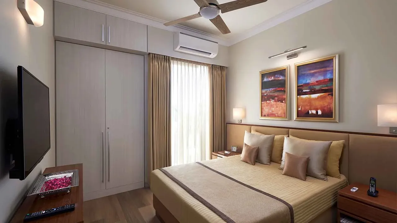 Central Park Flamingo Floors master bedroom with a split AC and wardrobe