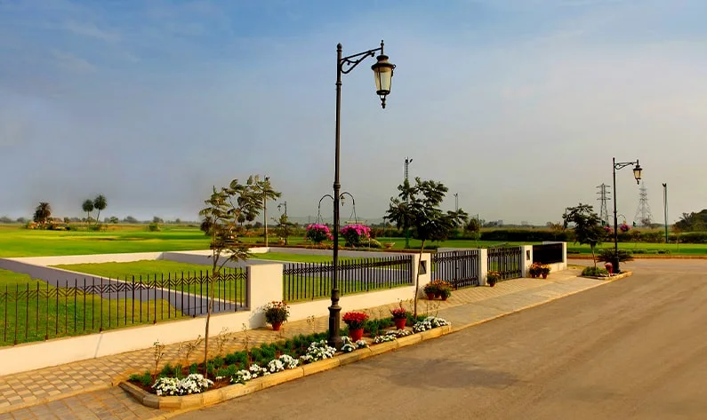 Central Park Mikasa Plots wide plotted street with lamp posts in Mikasa