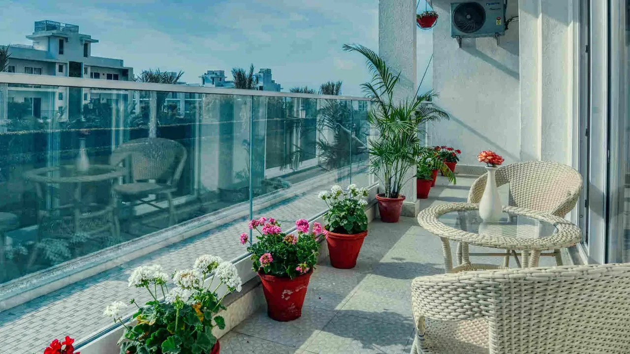 Central Park The Room wide balcony with plants and seating