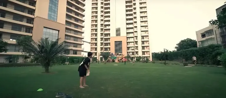 Chintels Serenity central lawn between the finished residential towers