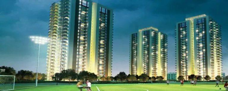 Conscient Heritage One towers beside the sports lawn at night, artist's impression