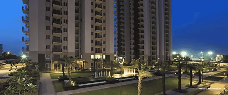 Conscient Heritage One towers and fountain courtyard at night