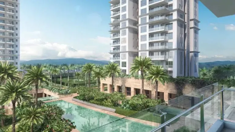 Conscient Hines Elevate towers over the water court, seen from a balcony
