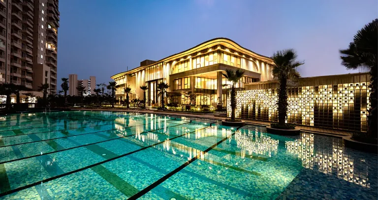 County The Center Court main swimming pool and clubhouse lit up in the evening