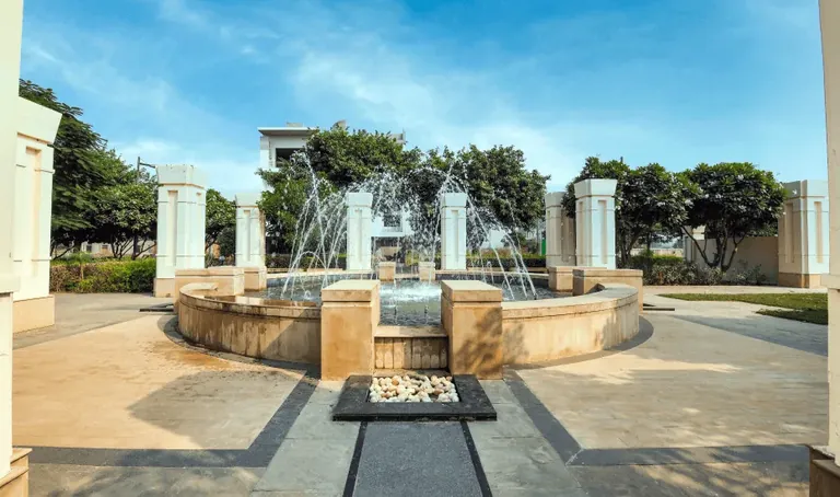 DLF Alameda fountain plaza with stone columns, actual photo