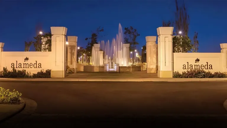 DLF Alameda entrance gate with lit fountain at night, Sector 73 Gurgaon