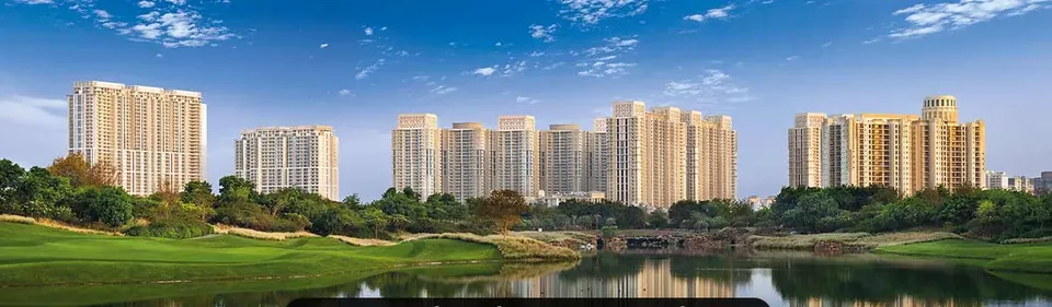 DLF The Crest towers across the golf course lake