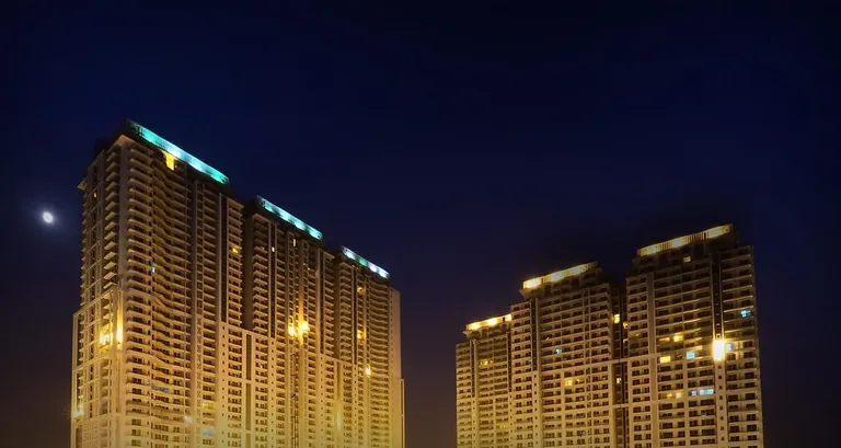 DLF The Crest towers seen from below at night