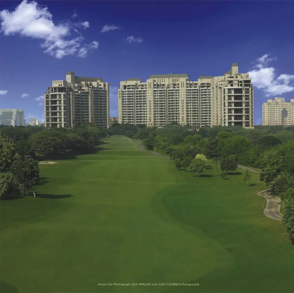 DLF The Magnolias towers seen across the golf course fairway