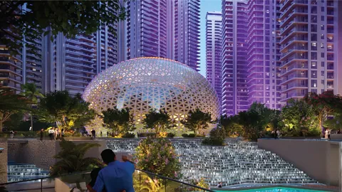 Elan The Emperor clubhouse dome lit up among the towers at dusk, artist's impression