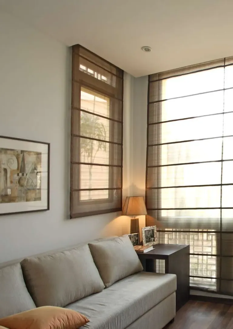 Emaar MGF Emerald Floors Premier sitting area with full-height windows