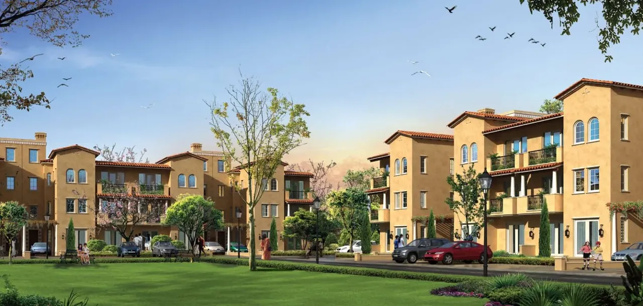 Emaar MGF Emerald Floors low-rise blocks seen across a landscaped lawn, artist's impression