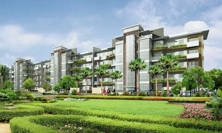 Emaar MGF The Palm Drive Palm Terraces low-rise blocks facing a clipped lawn, artist's impression