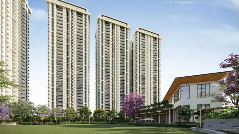 Emaar Urban Ascent high-rise towers behind the clubhouse and flowering trees, artist's impression