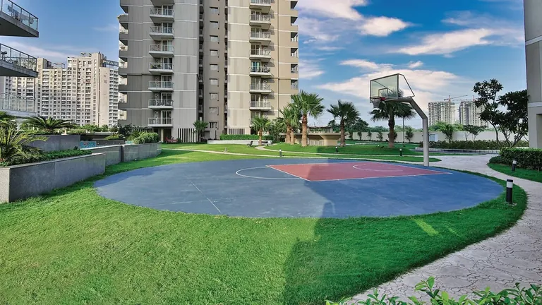 Experion The Heartsong half basketball court and lawns between towers, actual photo