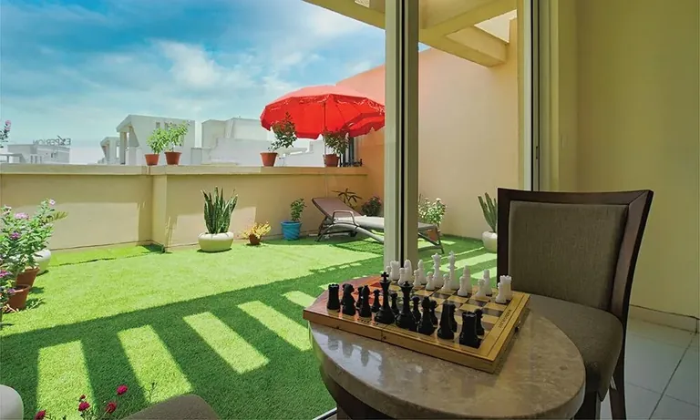 Experion The Heartsong terrace lawn with outdoor chess set, actual photo